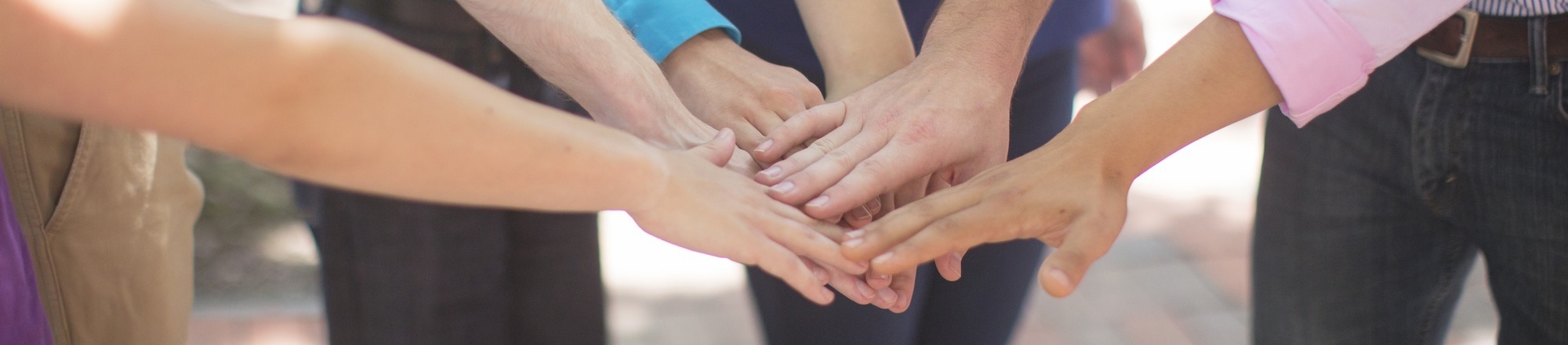 Helping b b m. люди помогают друг другу. Helping b b m. Helping b b m. Logo showing people helping each other.